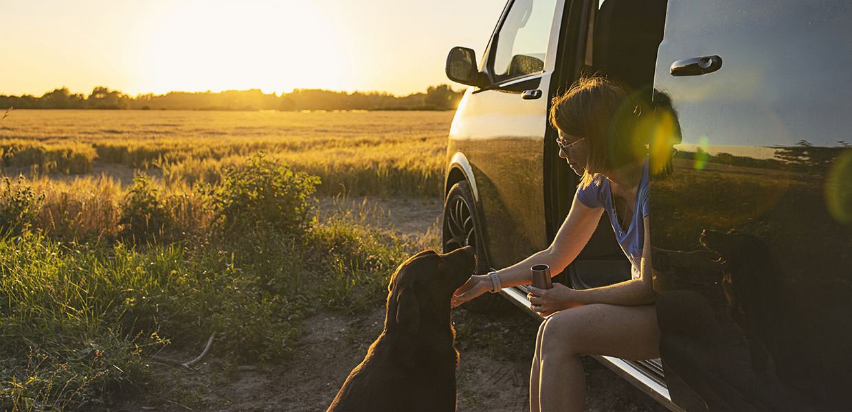 Woman sitting in Conversion van.